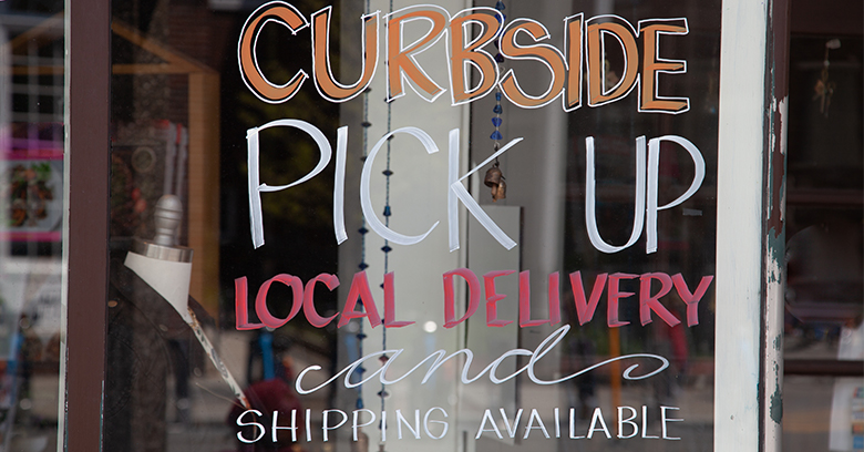 Curbside, pick up, local delivery, and shipping available on the front of a store.